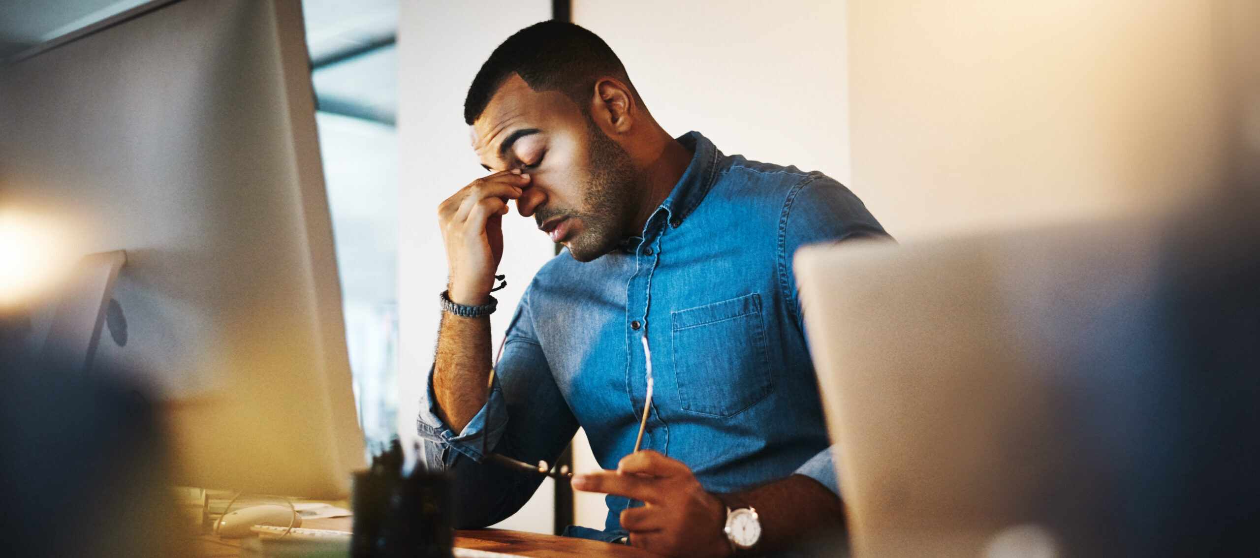 investor with headache after managing properties for hours